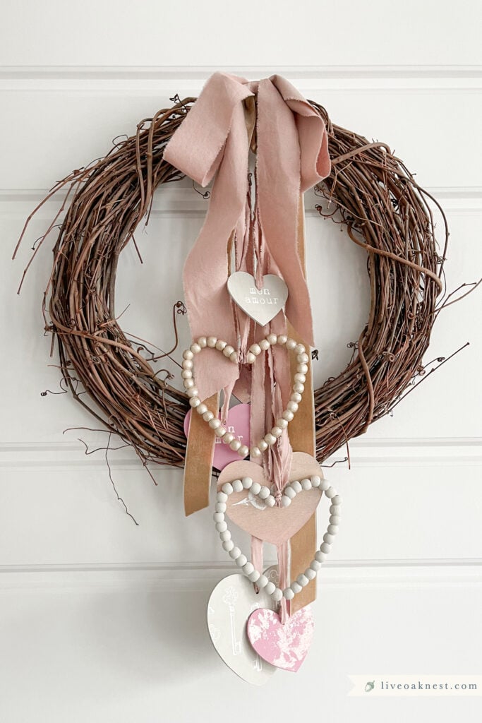 DIY Rustic Valentine Wreath with Yarn and hearts - The Crafting Nook