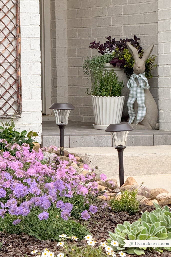 Small Front Porch Decor, Garden Rabbit Figurine, Potted Plants, Outdoor Lighting, Willow Trellis, Cottage Style Curb Appeal