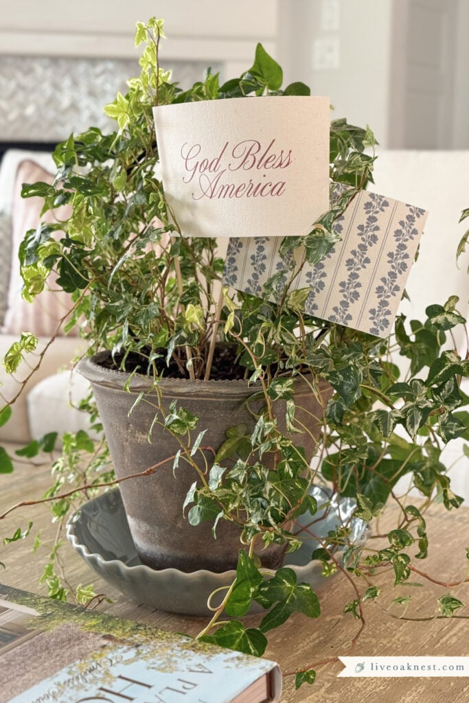 English Ivy Topiary with God Bless American and Blue Floral Flag