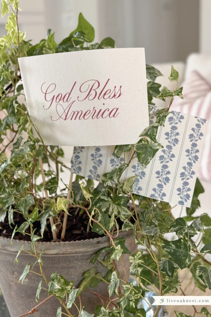 DIY Handmade Patriotic Flags Made from Printable Canvas and Wooden Dowels. English Ivy Houseplant for Classic Americana Decor